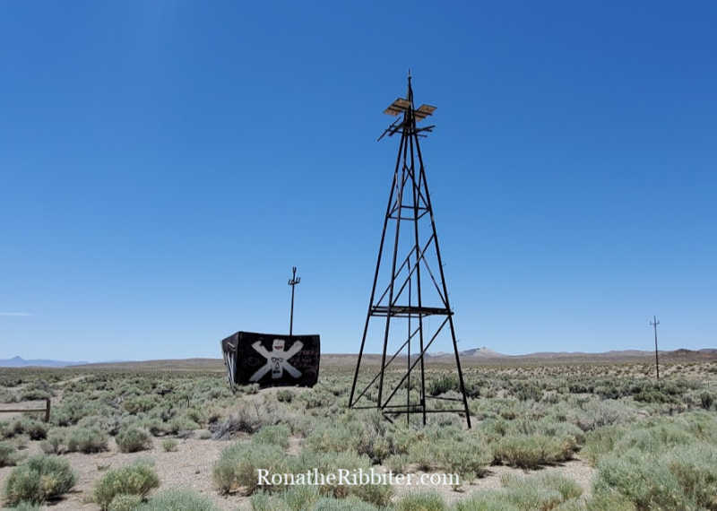 Old windmill and bucket on quilters road trip in nevada